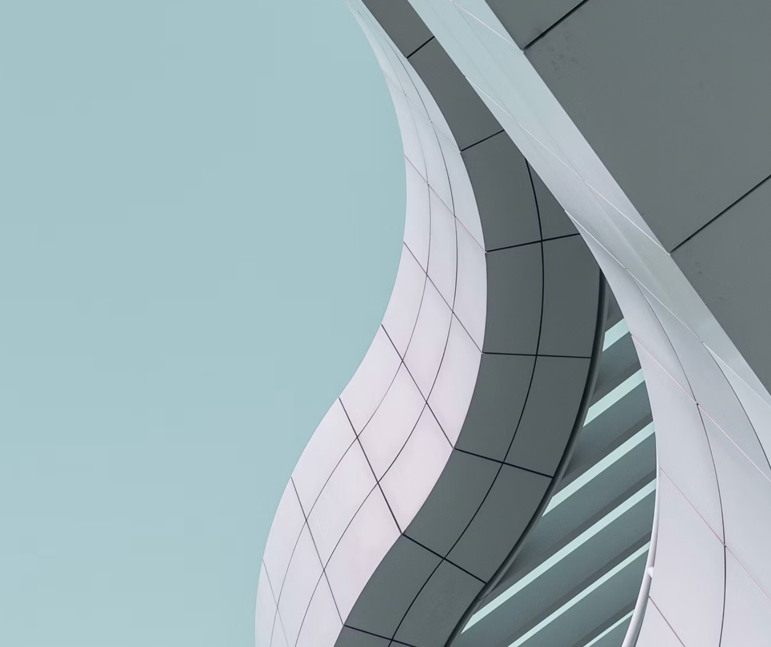 Upward view of curved contemporary architecture