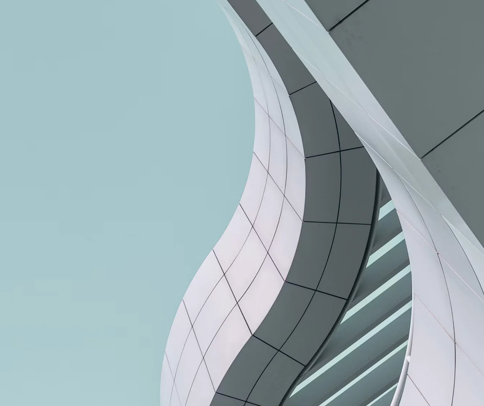 Upward view of curved contemporary architecture